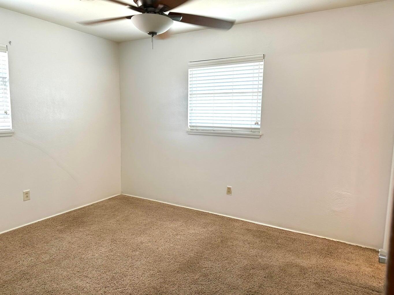 2615 West 19th Plainview, TX 79072 - Photo 6 of 15 an empty room with a window