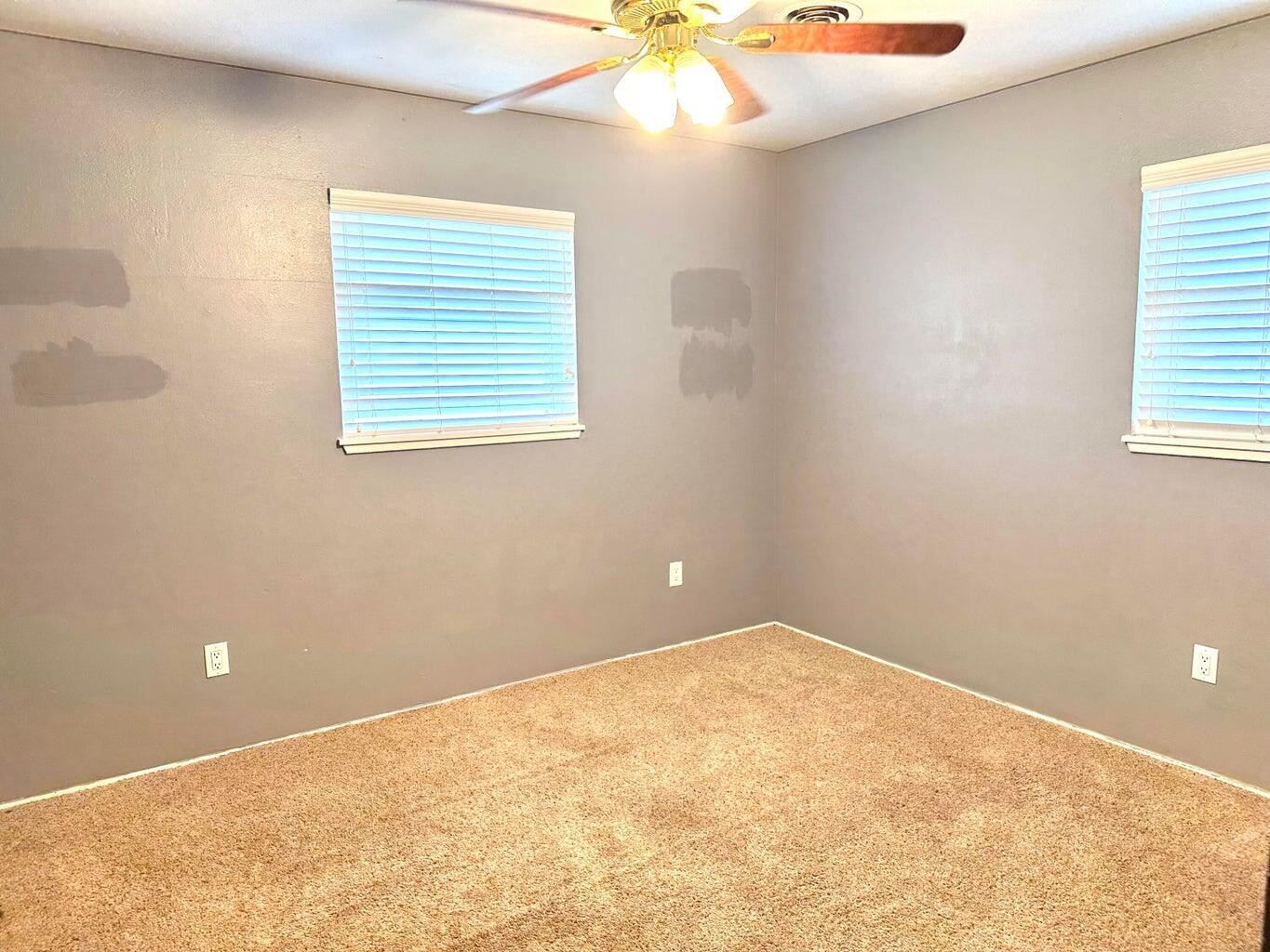 2615 West 19th Plainview, TX 79072 - Photo 9 of 15 an empty room with a window