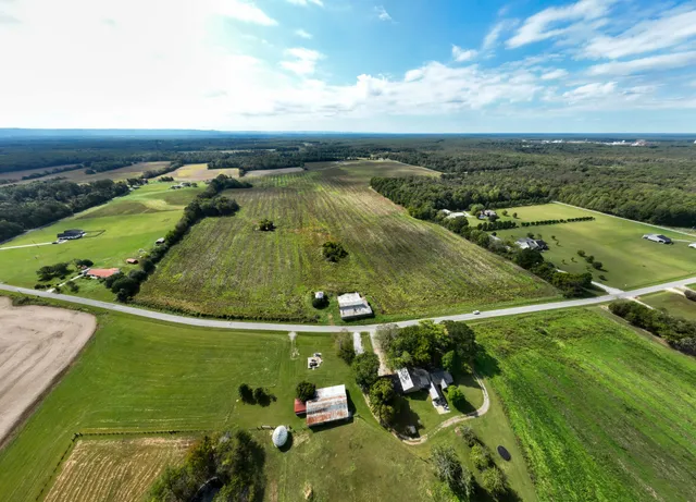 an aerial view of a houses with outdoor space