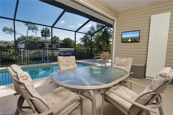 a patio with a table and chairs