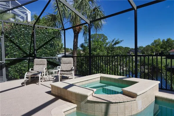 a view of a chairs and table in the patio