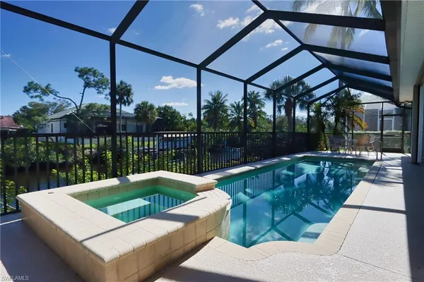 a view of a swimming pool with a patio