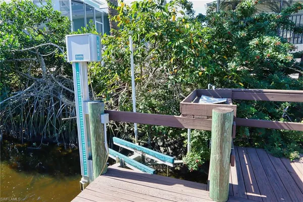 a view of a street with a sign on the wall