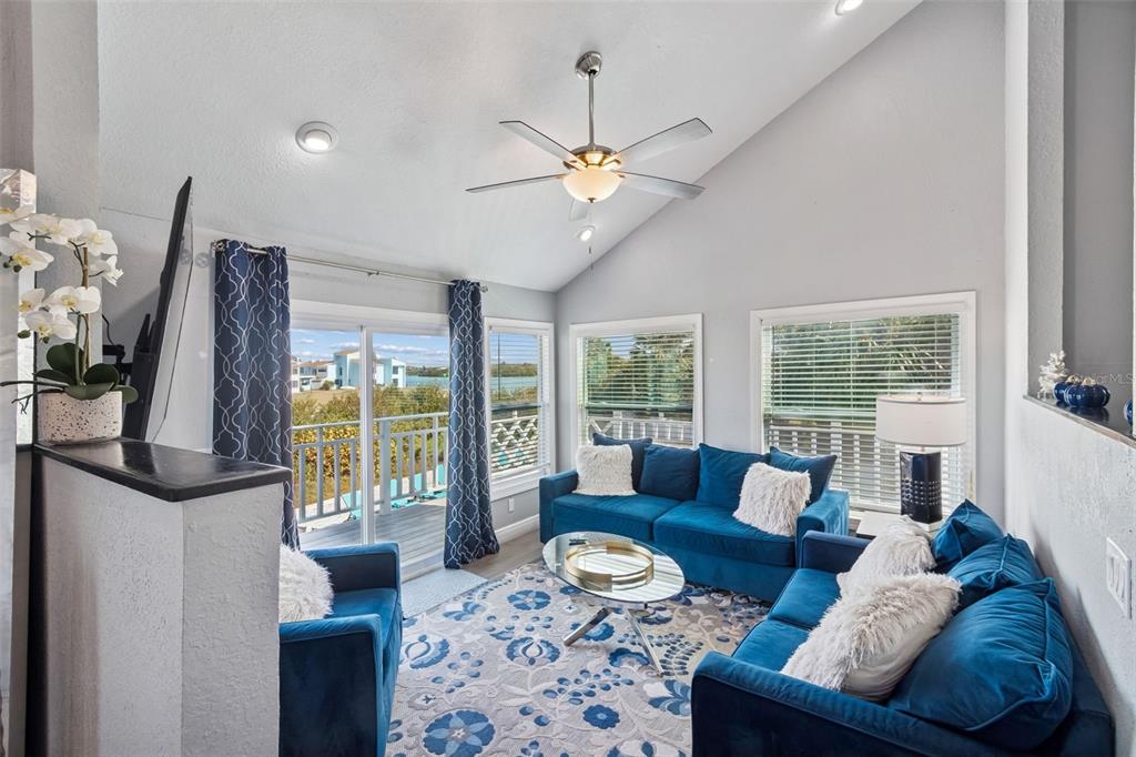 330 6th Avenue Indian Rocks Beach, FL 33785 - Photo 21 of 52 a living room with furniture and a large window