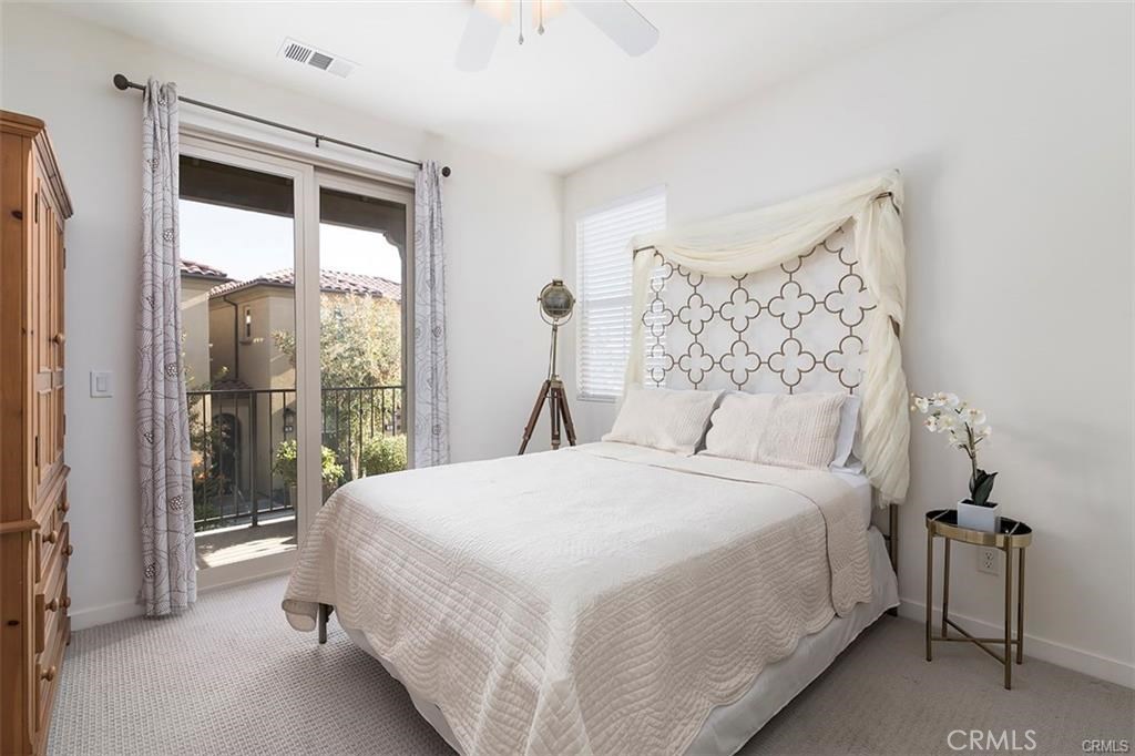 88 Agave Lake Forest, CA 92630 - Photo 13 of 26 a bedroom with a large bed and a window