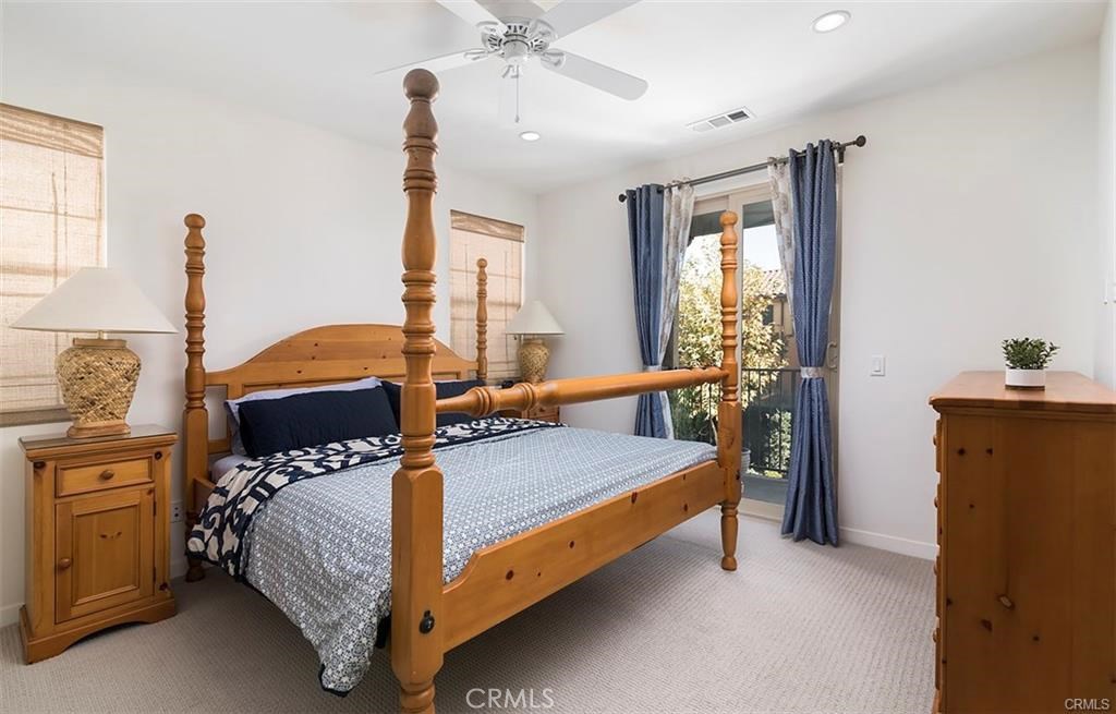 88 Agave Lake Forest, CA 92630 - Photo 15 of 26 a bedroom with a bed and wooden floor