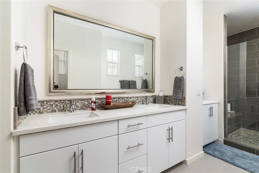 88 Agave Lake Forest, CA 92630 - Photo 18 of 26 a bathroom with a sink and a mirror