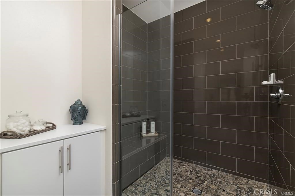 88 Agave Lake Forest, CA 92630 - Photo 19 of 26 a bathroom with a bathtub and a shower