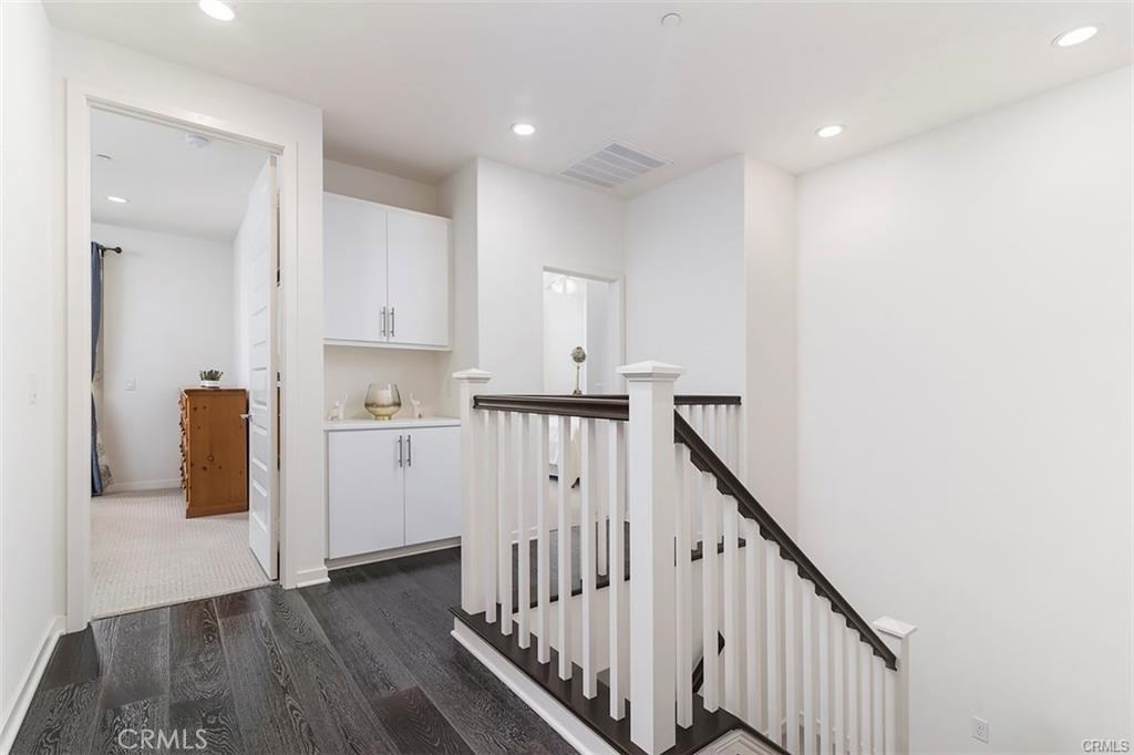 88 Agave Lake Forest, CA 92630 - Photo 20 of 26 a view of hallway with stairs and wooden floor
