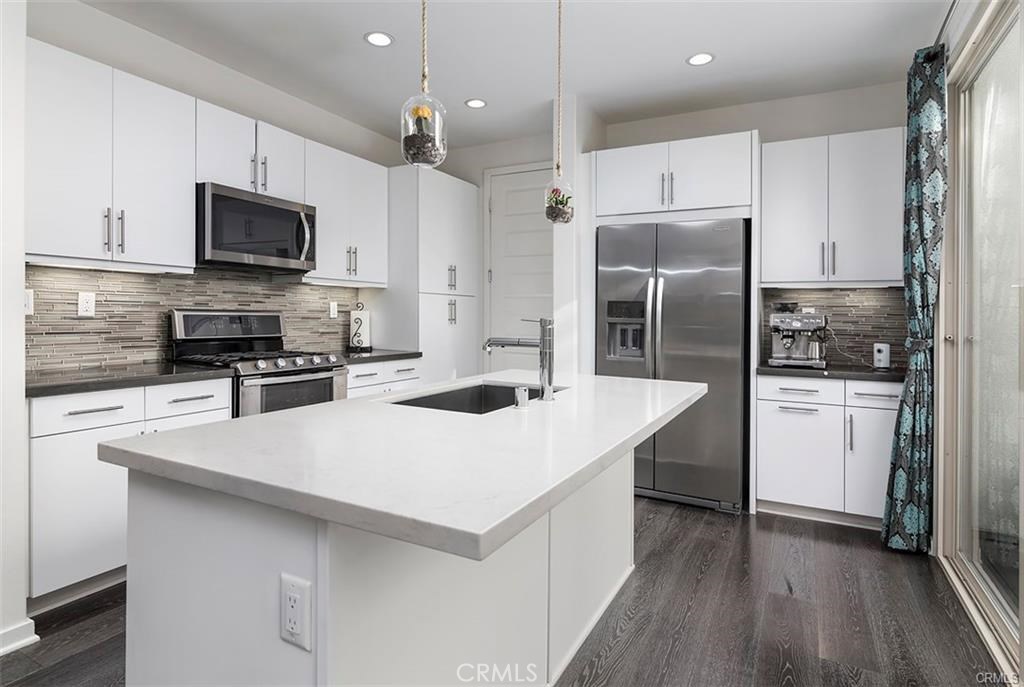 88 Agave Lake Forest, CA 92630 - Photo 5 of 26 a kitchen with stainless steel appliances a refrigerator and a stove top oven