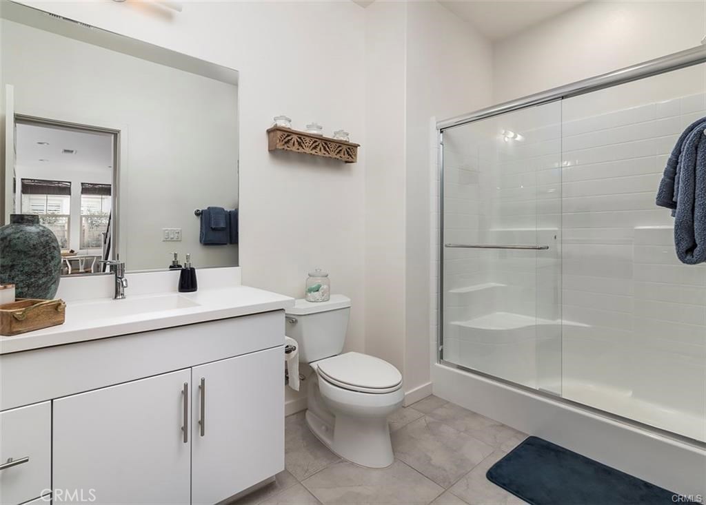 88 Agave Lake Forest, CA 92630 - Photo 9 of 26 a bathroom with a sink a toilet and shower