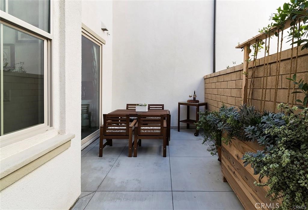 88 Agave Lake Forest, CA 92630 - Photo 10 of 26 a backyard view with a couch and potted plants