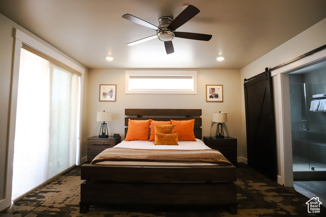 2331 Mesa Road, Unit E3 Moab, UT 84532 - Photo 6 of 71 Bedroom featuring a barn door and ceiling fan