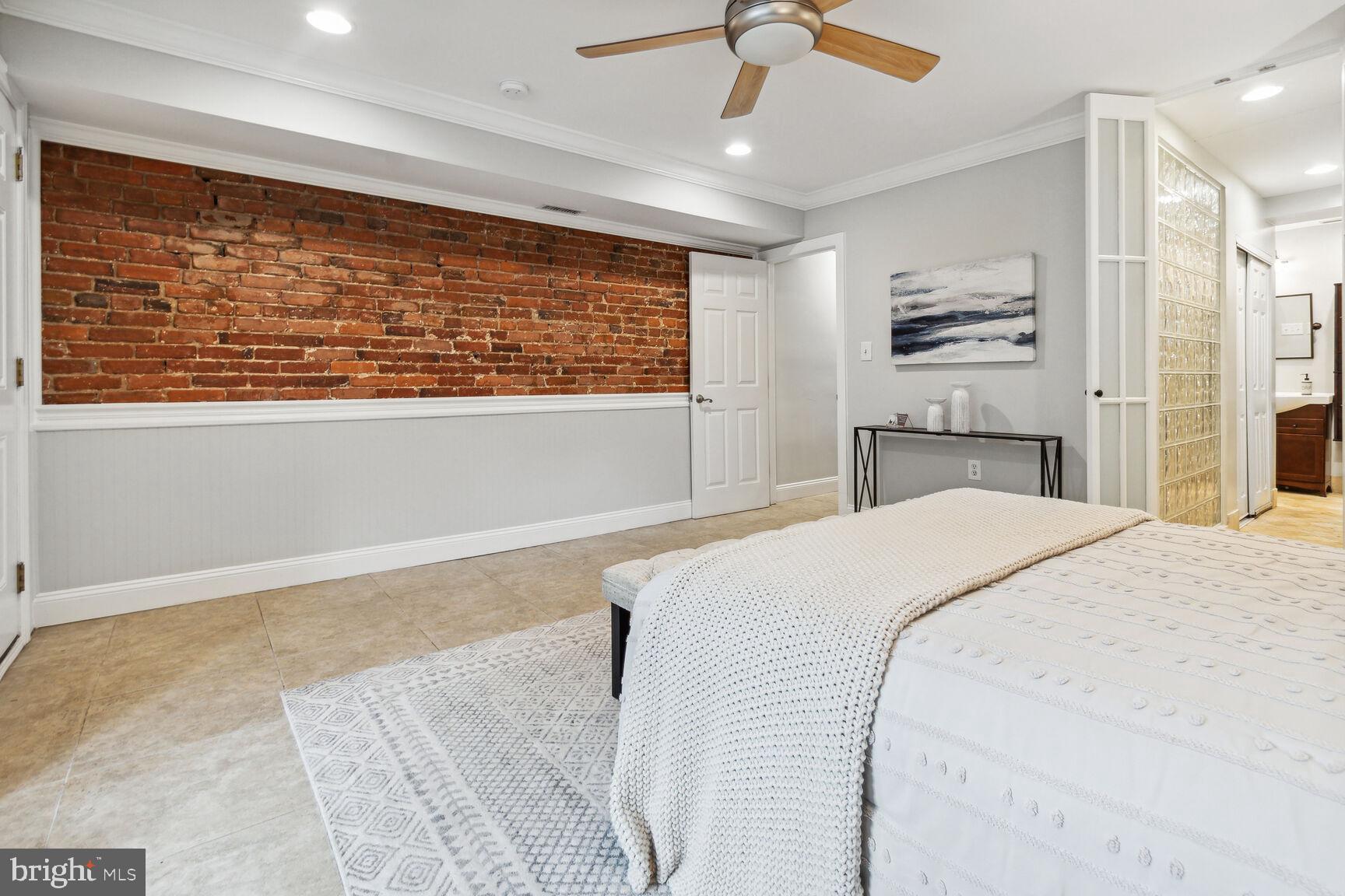 45 R Street Northwest, Unit 1 Washington, DC 20001 - Photo 11 of 21 Exposed brick in primary bedroom