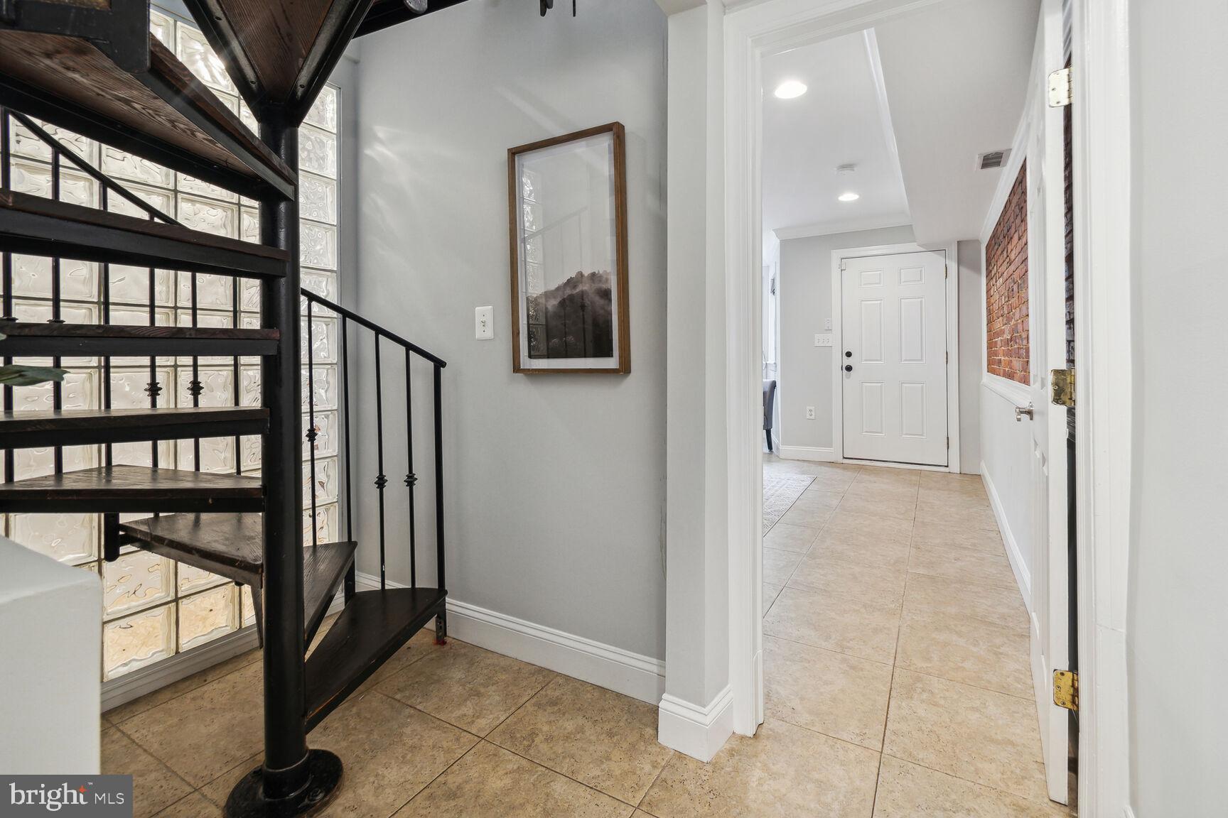45 R Street Northwest, Unit 1 Washington, DC 20001 - Photo 9 of 21 Spiral staircase to lower level.