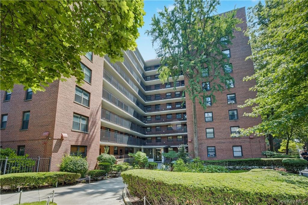 a front view of a building with garden