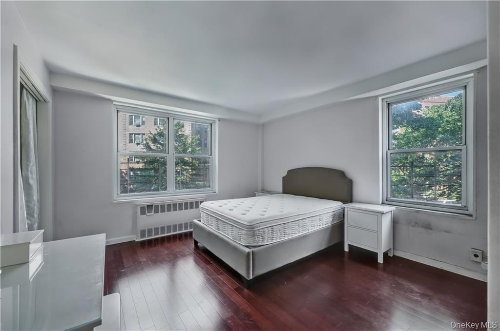 35-11 85th Street, Unit 3H Queens, NY 11372 - Photo 14 of 27 a bedroom with a bed and window