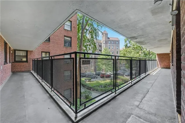 a view of balcony with floor to ceiling window with wooden floor