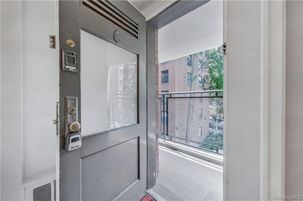 35-11 85th Street, Unit 3H Queens, NY 11372 - Photo 6 of 27 a bathroom with a glass shower door
