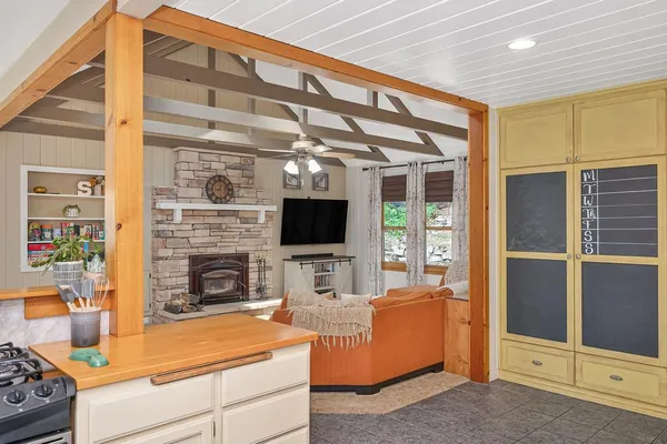 a bedroom with a bed and a book shelf