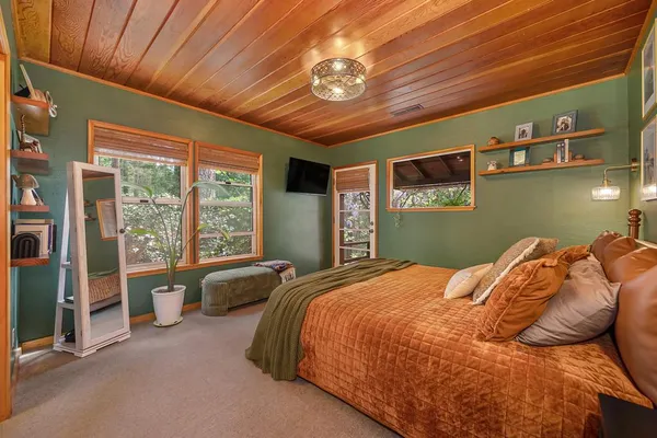 a backyard of a house with lots of green space and fountain view