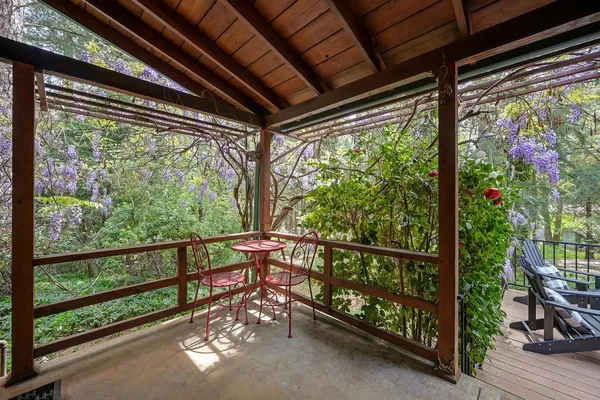 a front view of a house with a yard table and chairs
