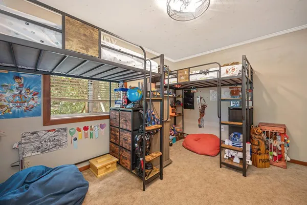 a backyard of a house with fire pit and trees