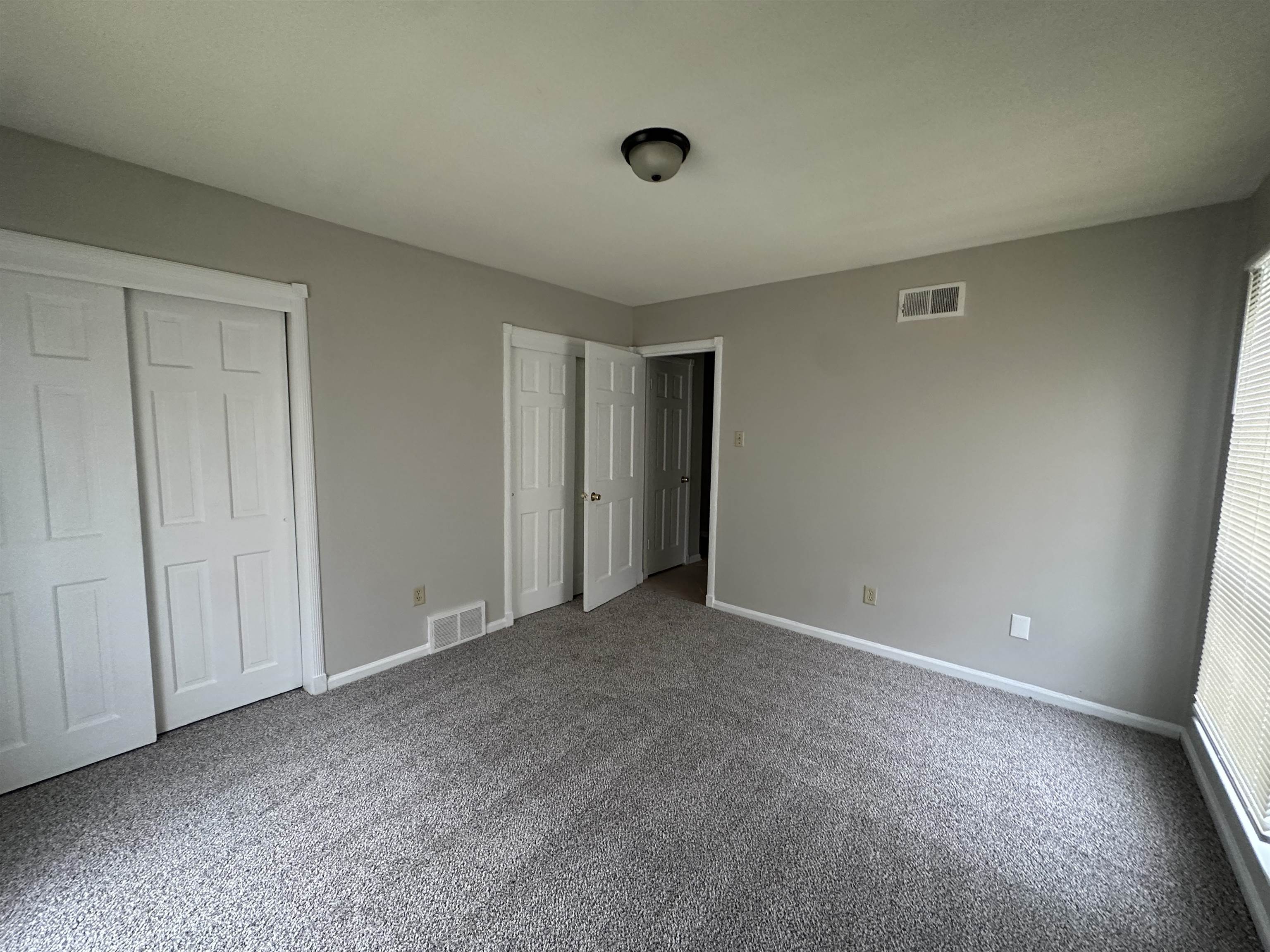 1931 Stone Bridge Drive Memphis, TN 38134 - Photo 11 of 16 Unfurnished bedroom featuring a closet and carpet flooring