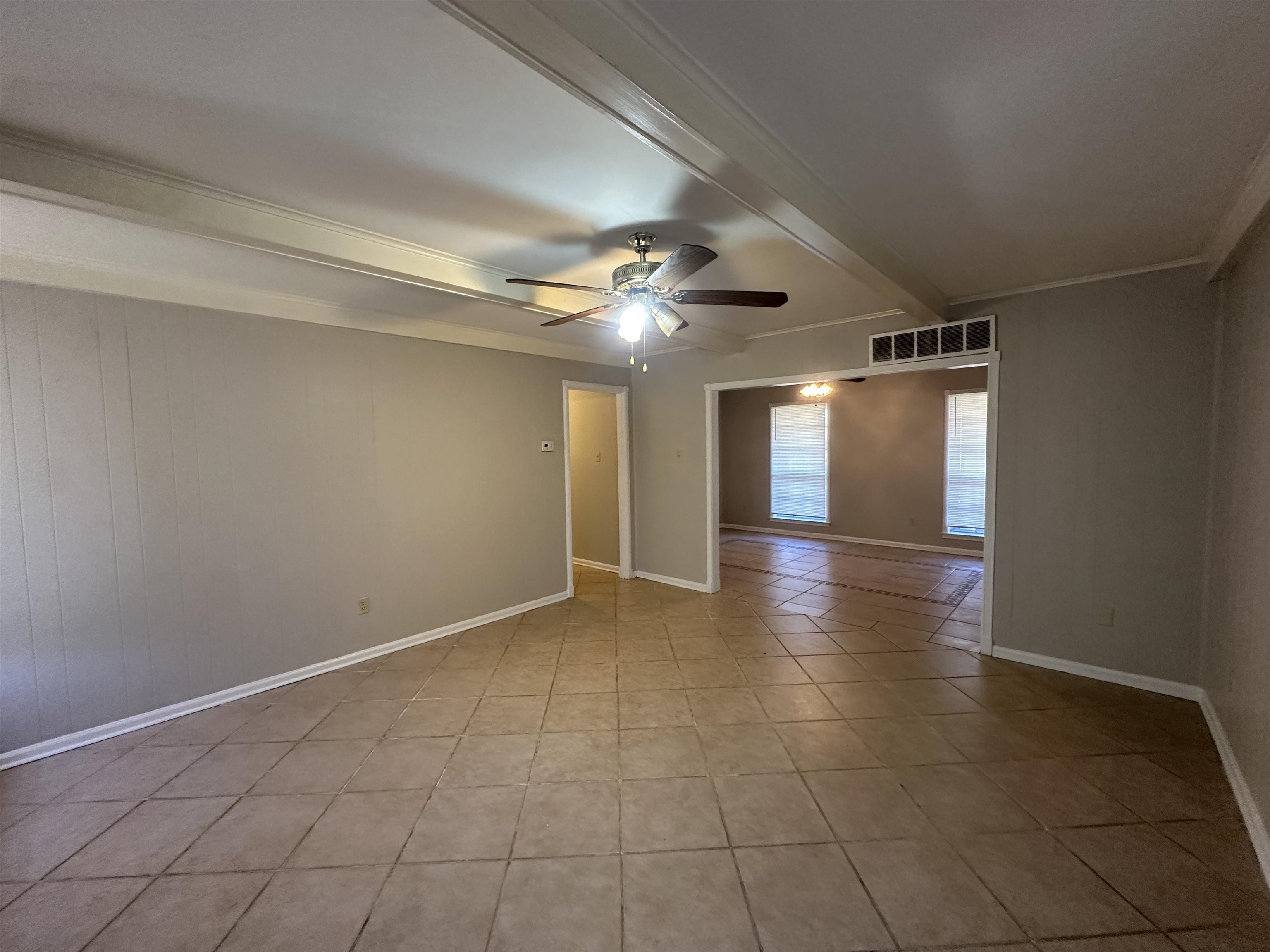 1931 Stone Bridge Drive Memphis, TN 38134 - Photo 16 of 16 Unfurnished room with beam ceiling, a ceiling fan, and light tile patterned floors