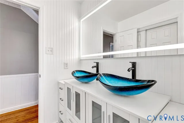 a view of a house with a big yard and large trees