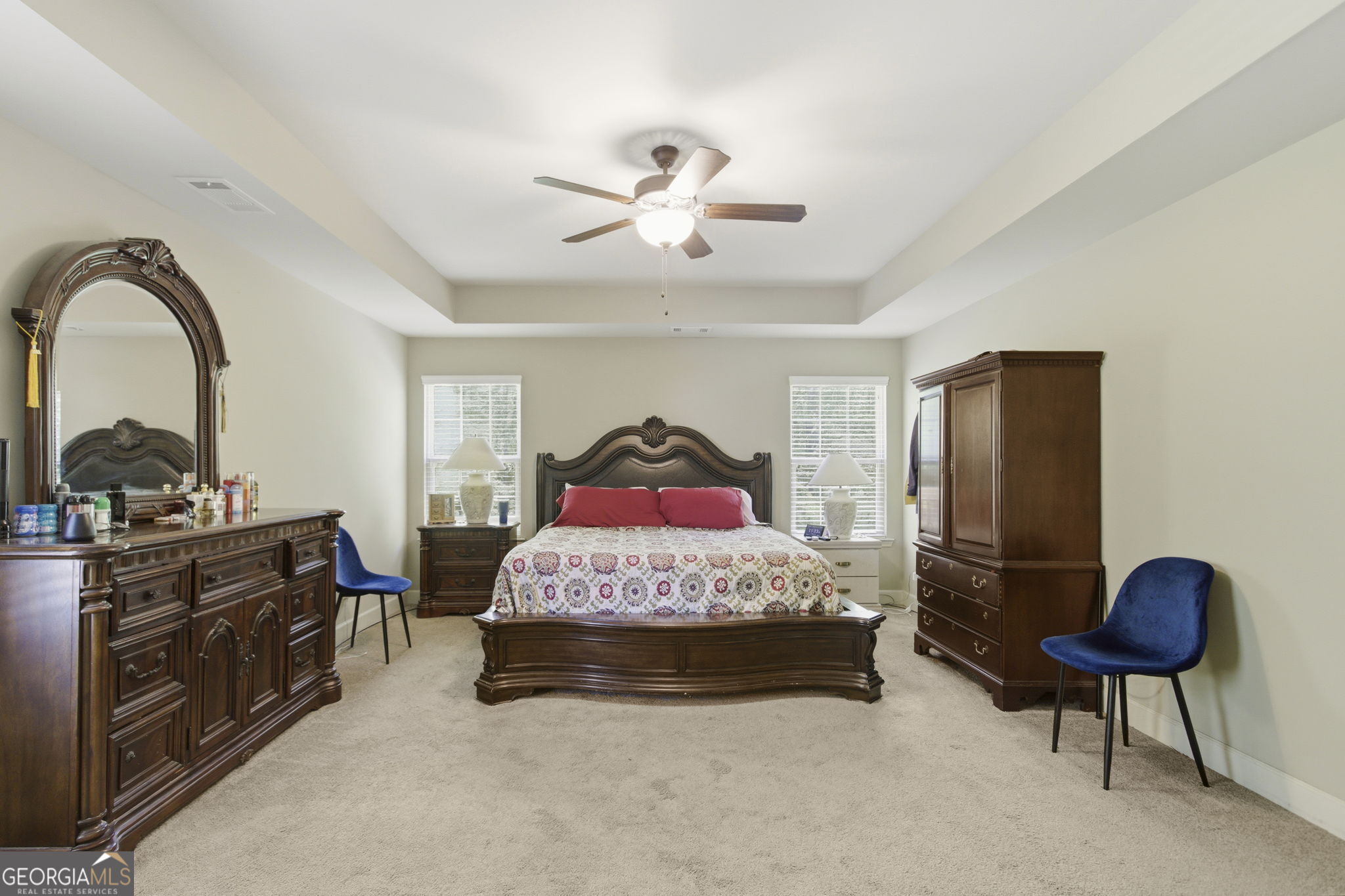 127 Austin Storey Circle Newnan, GA 30263 - Photo 17 of 34 a bedroom with a bed and a chandelier