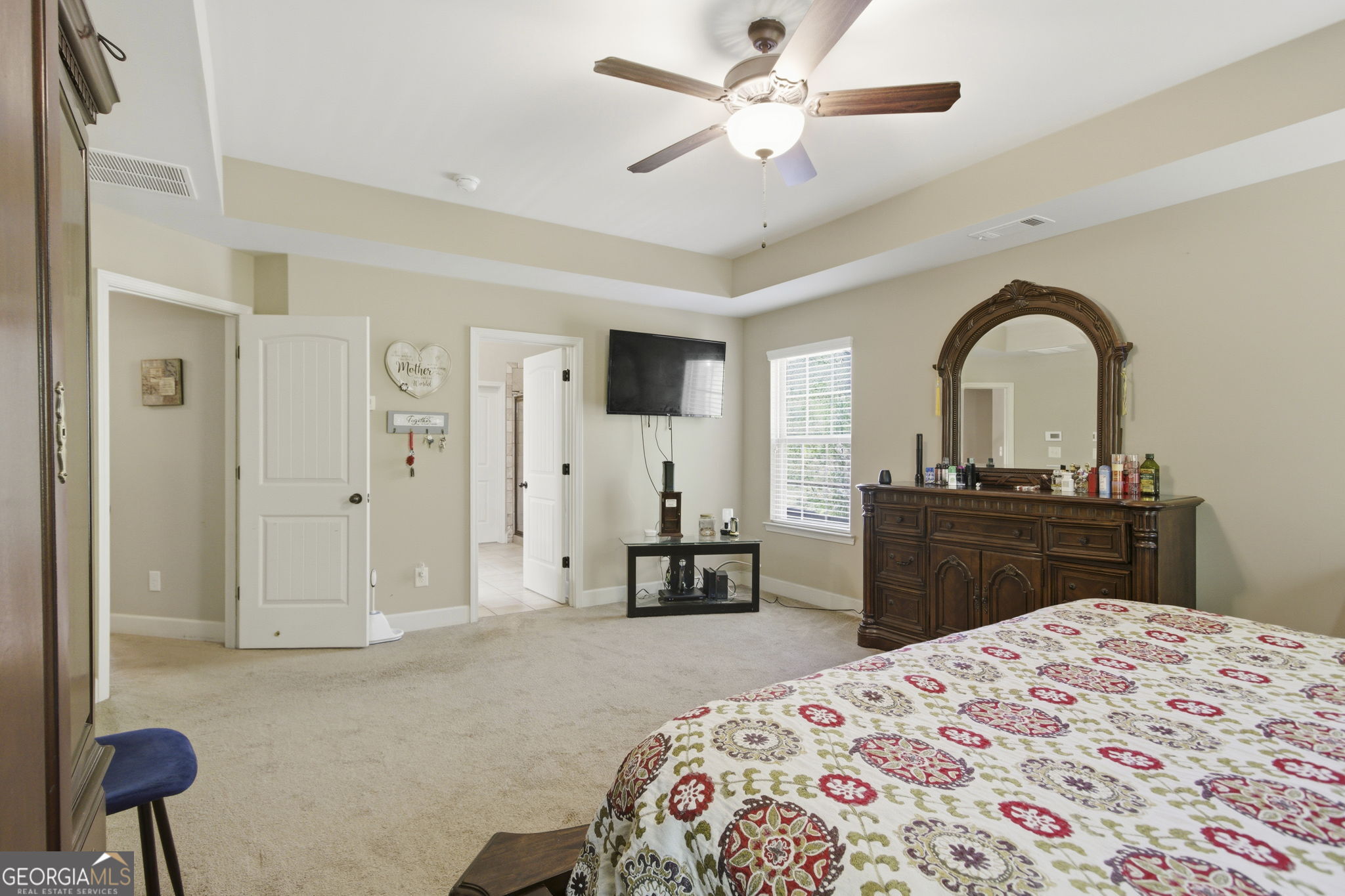 127 Austin Storey Circle Newnan, GA 30263 - Photo 18 of 34 a bedroom with a bed and a dresser