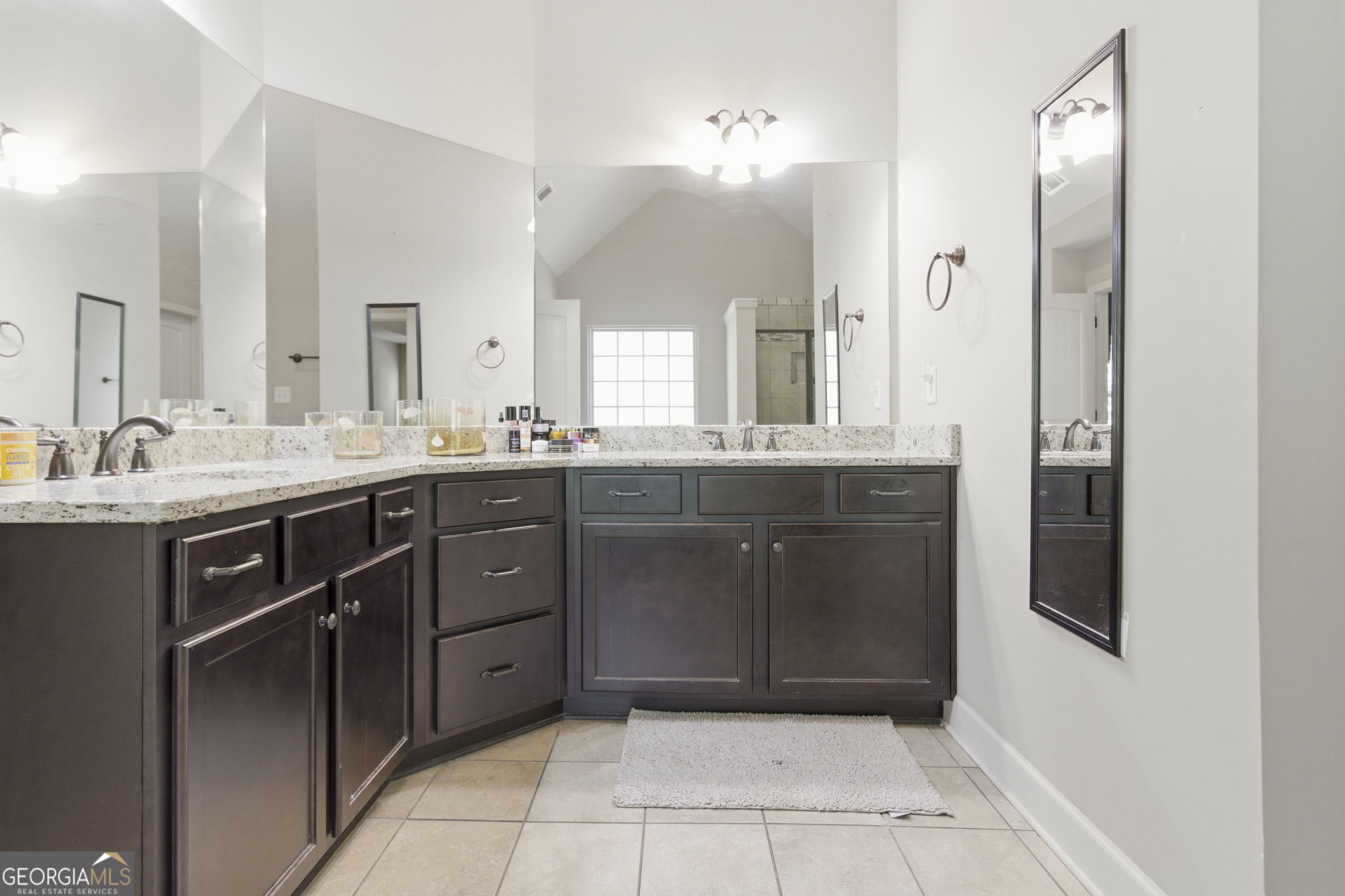 127 Austin Storey Circle Newnan, GA 30263 - Photo 19 of 34 a bathroom with a sink vanity and mirror