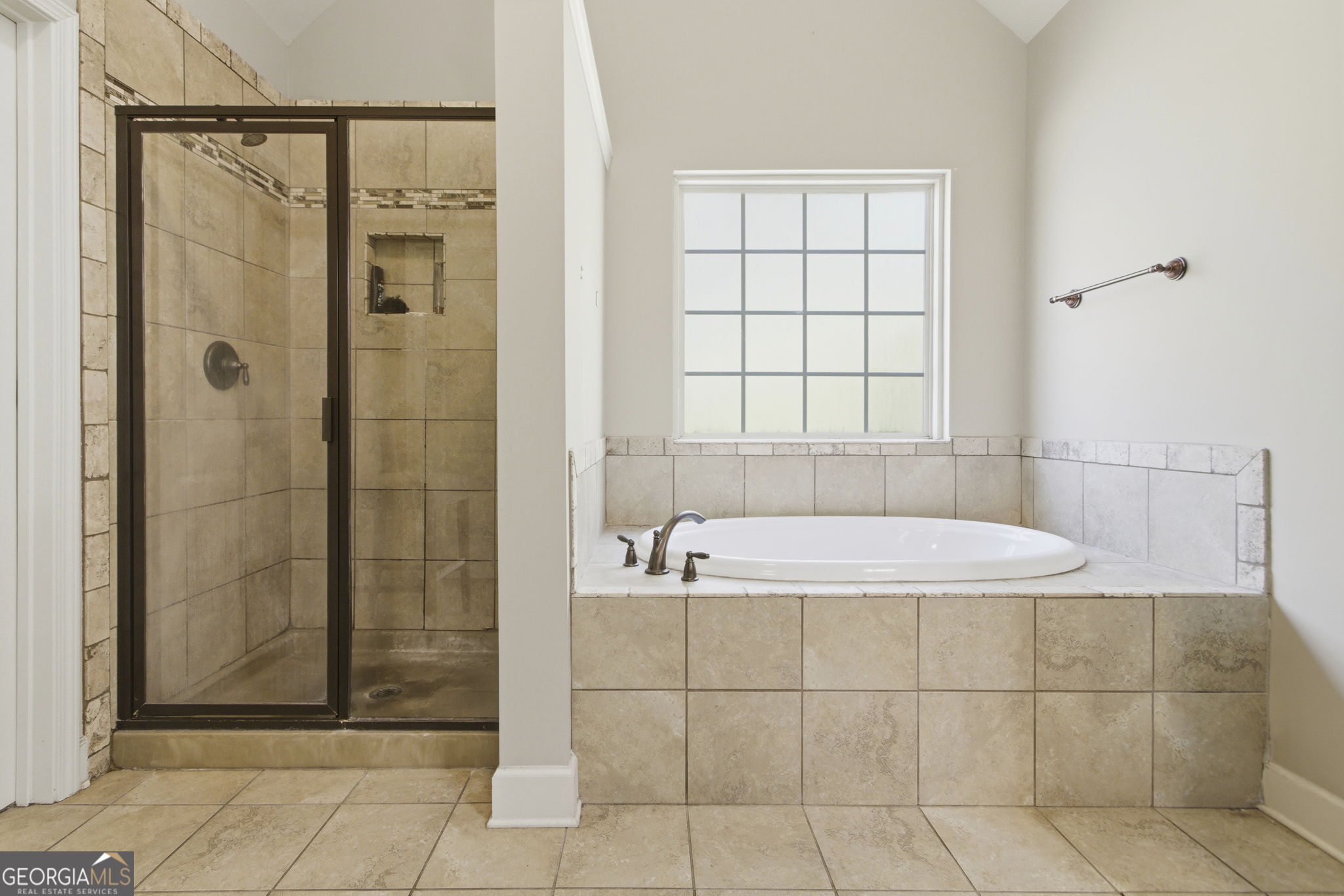 127 Austin Storey Circle Newnan, GA 30263 - Photo 20 of 34 a bathroom with a tub and shower