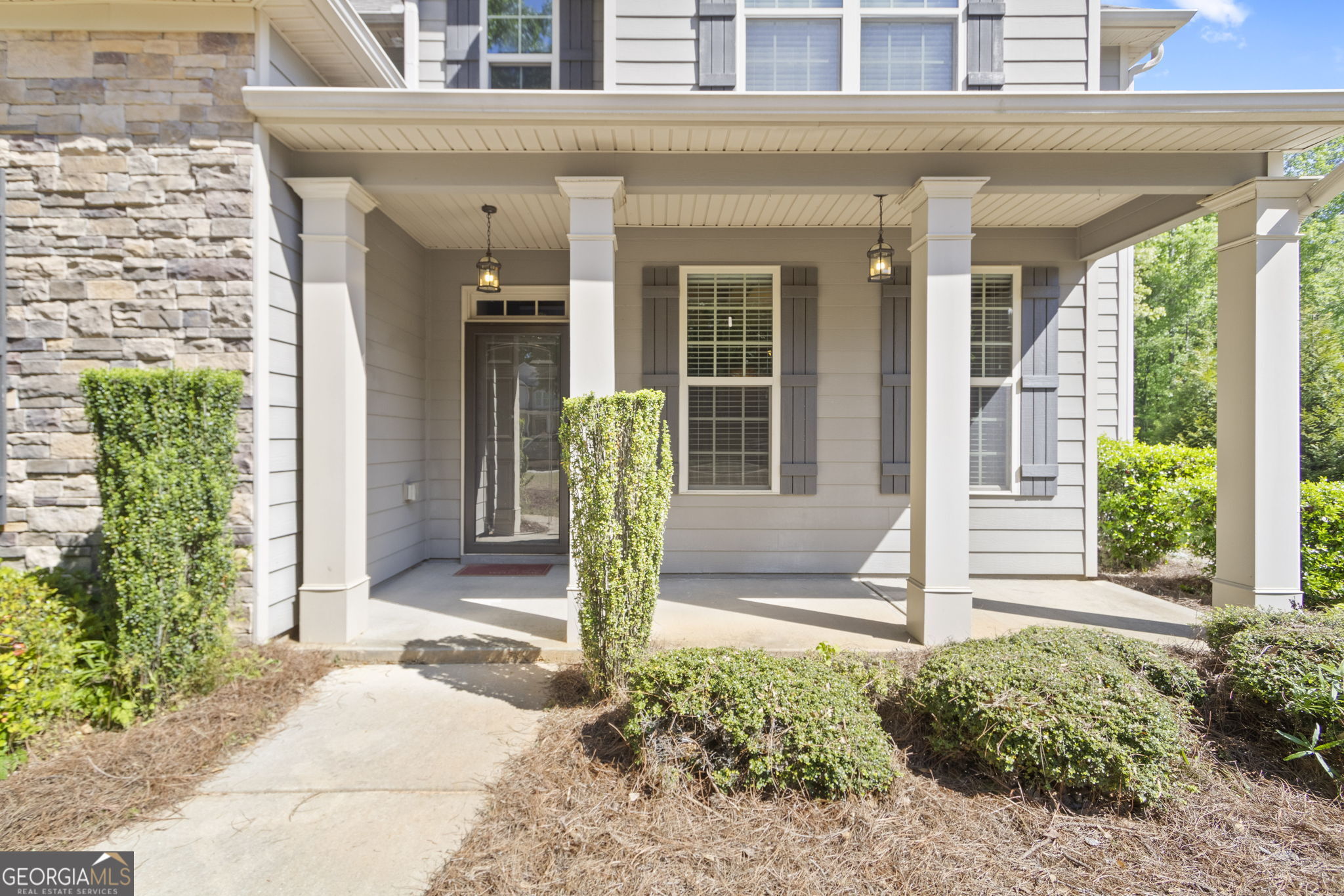 127 Austin Storey Circle Newnan, GA 30263 - Photo 2 of 34 a front view of a house with a porch