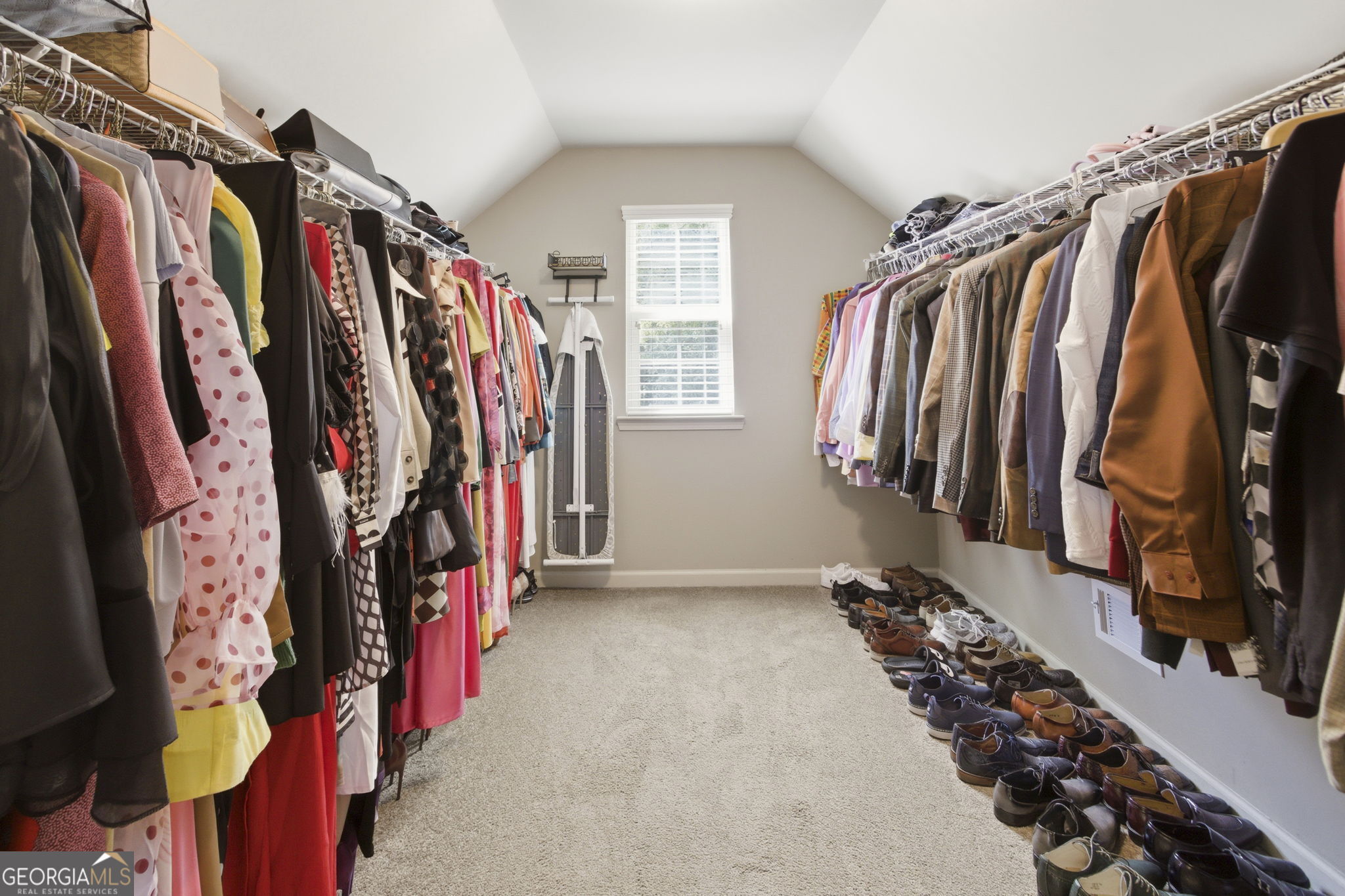 127 Austin Storey Circle Newnan, GA 30263 - Photo 22 of 34 a view of walk in closet with clothes and shoes
