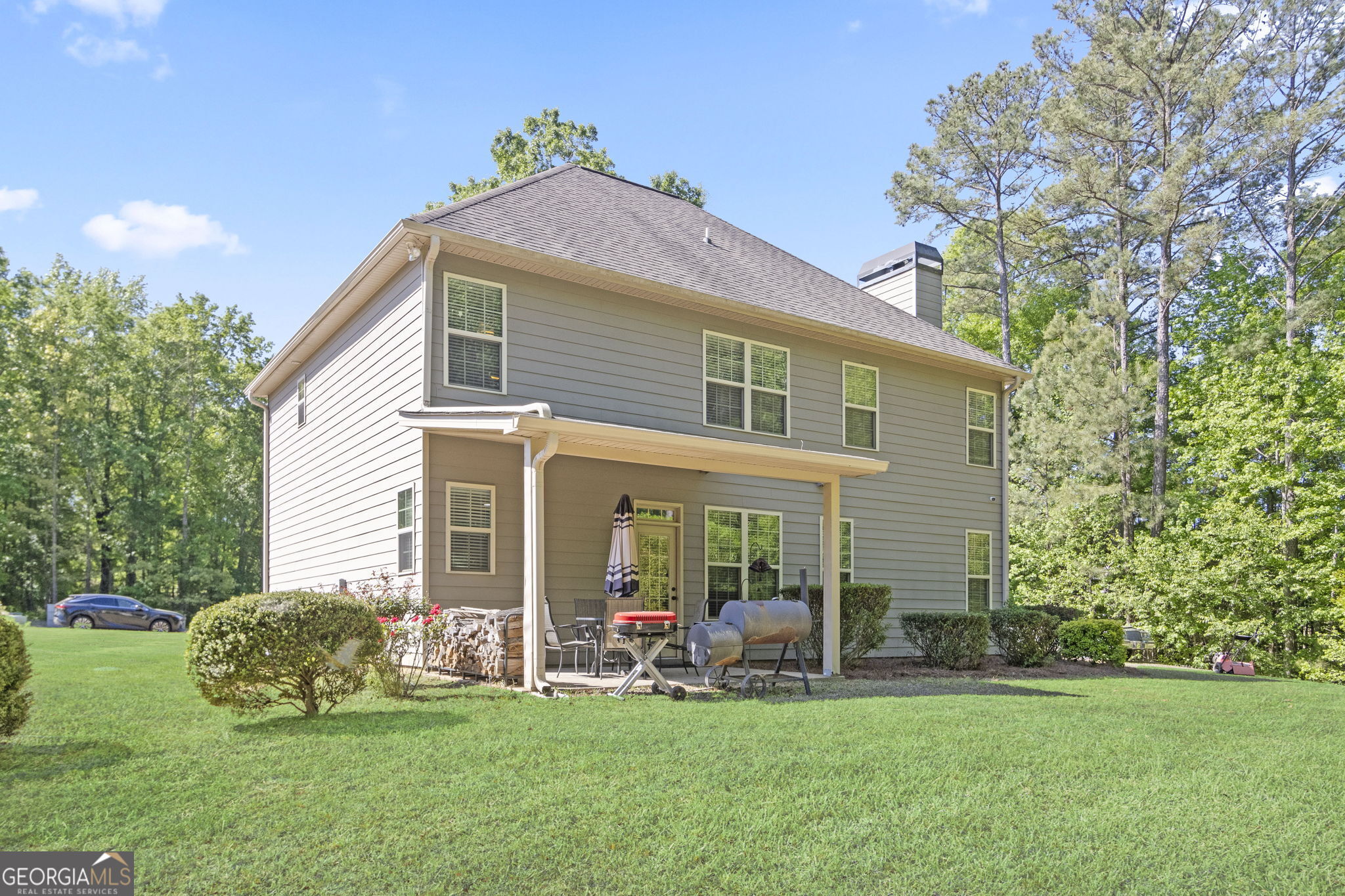 127 Austin Storey Circle Newnan, GA 30263 - Photo 32 of 34 a front view of a house with a yard and porch