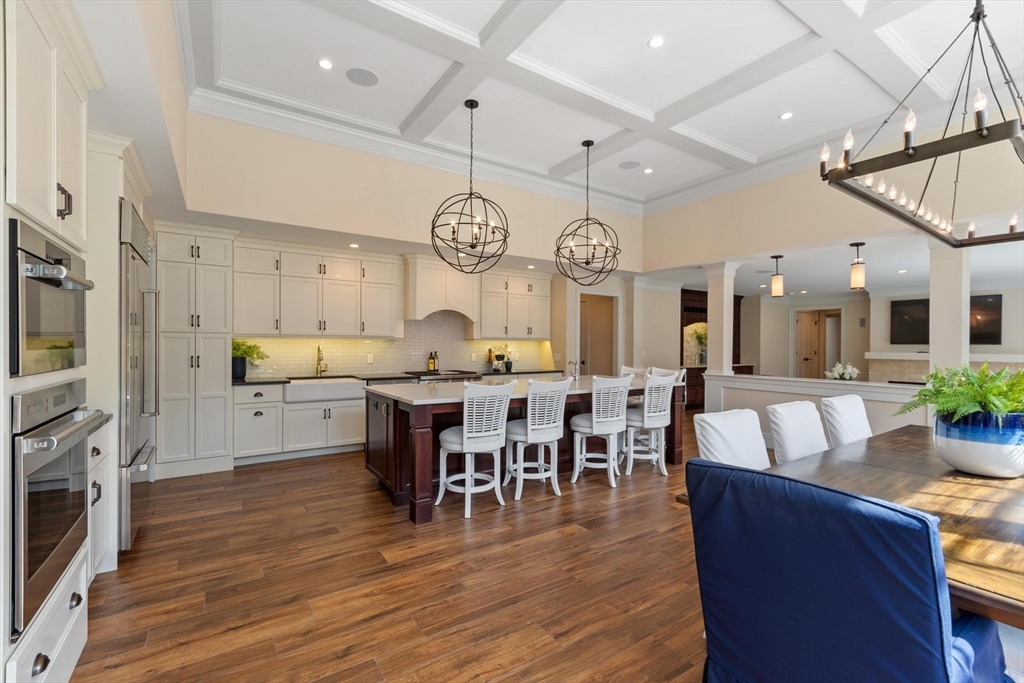 18 South Shaker Road Harvard, MA 01451 - Photo 12 of 40 a large kitchen with a table and chairs in it