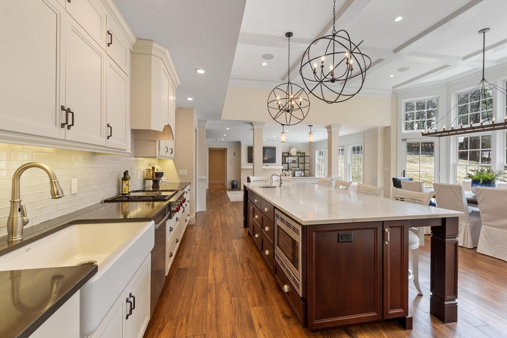 18 South Shaker Road Harvard, MA 01451 - Photo 15 of 40 a kitchen with stainless steel appliances granite countertop a sink a stove top oven a clock and cabinets