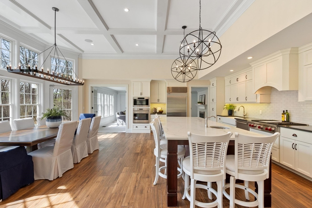 18 South Shaker Road Harvard, MA 01451 - Photo 17 of 40 a view of a dining room with furniture wooden floor and chandelier