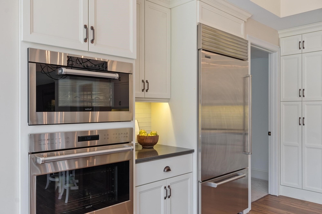18 South Shaker Road Harvard, MA 01451 - Photo 18 of 40 a kitchen with stainless steel appliances a stove microwave and refrigerator