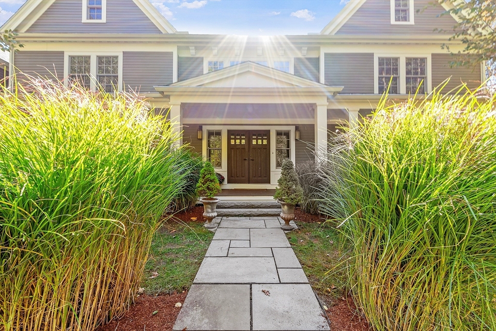 18 South Shaker Road Harvard, MA 01451 - Photo 2 of 42 a front view of a house with a yard