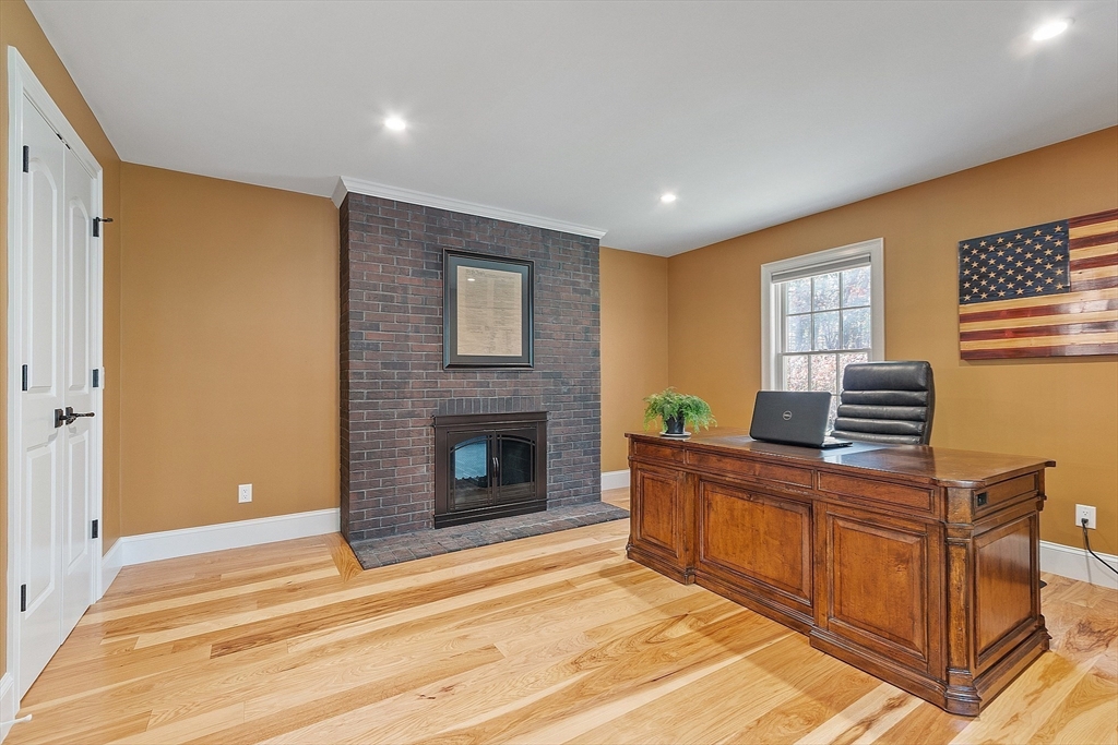 18 South Shaker Road Harvard, MA 01451 - Photo 21 of 42 a livingroom with a fireplace and a window
