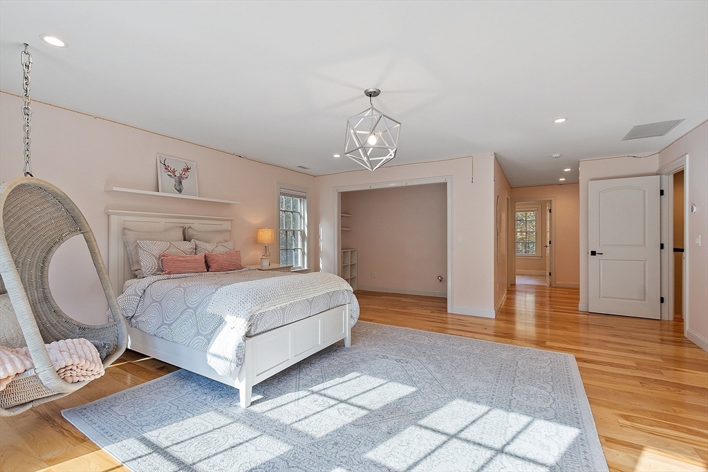 18 South Shaker Road Harvard, MA 01451 - Photo 23 of 42 a bedroom with a bed and wooden floor