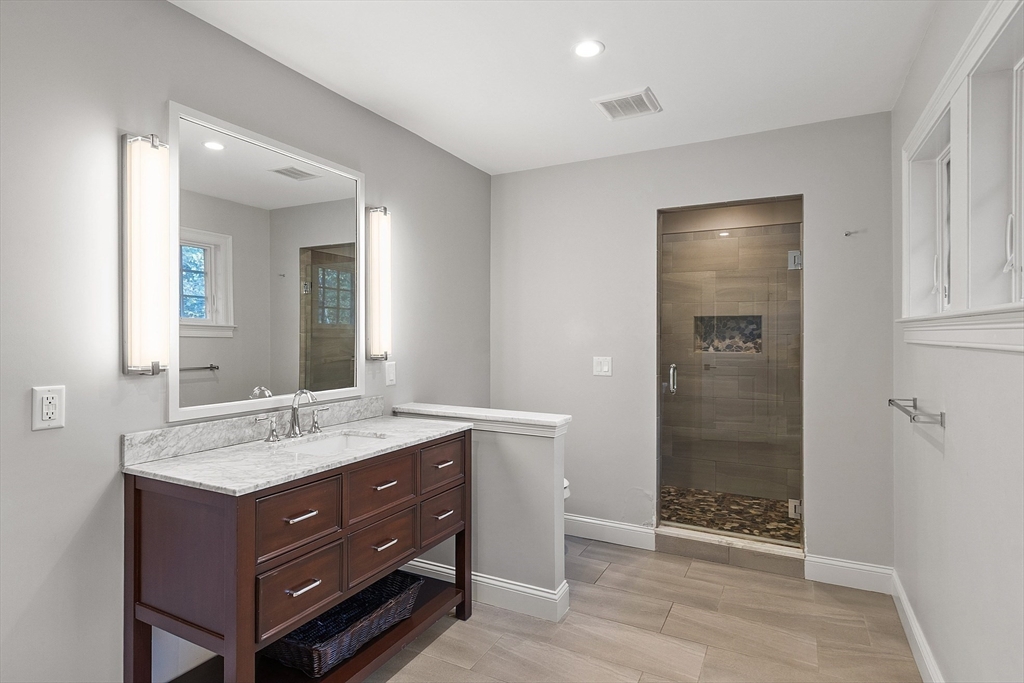 18 South Shaker Road Harvard, MA 01451 - Photo 26 of 42 a bathroom with a sink and a mirror