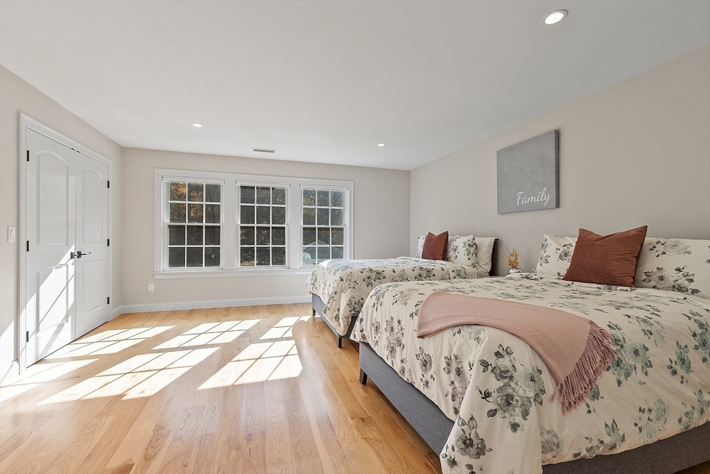 18 South Shaker Road Harvard, MA 01451 - Photo 27 of 42 a spacious bedroom with a large bed and a window