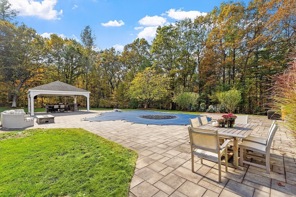 18 South Shaker Road Harvard, MA 01451 - Photo 34 of 42 a view of a house with backyard sitting area and garden