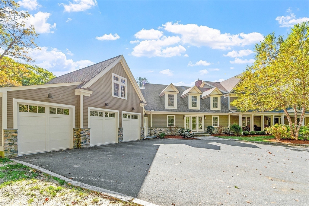 18 South Shaker Road Harvard, MA 01451 - Photo 36 of 42 a front view of a house with a yard