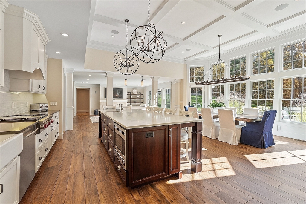 18 South Shaker Road Harvard, MA 01451 - Photo 5 of 42 a kitchen with stainless steel appliances granite countertop a kitchen island a stove a sink a dining table and chairs