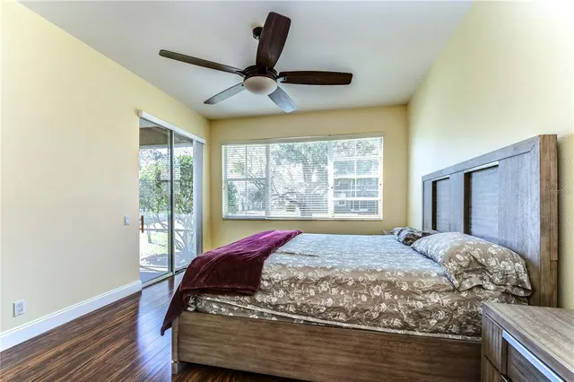 a bed sitting in a bedroom next to a window